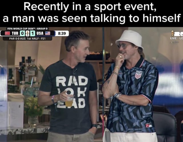 This meme features a real photograph of actors Edward Norton and Brad Pitt, who co-starred in the 1999 film *Fight Club*, talking to each other while attending the 2026 FIFA World Cup Group D match between Turkey and the USA. The top caption reads "Recently in a sport event, a man was seen talking to himself", which is a joke referencing the core plot of *Fight Club: Edward Norton's unnamed Narrator character has dissociative identity disorder, and Brad Pitt's character Tyler Durden is his imaginary alter ego. The title "I am Jack's Second Opinion" also references the Narrator's iconic running "I am Jack's [body part/feeling]" internal monologue lines from the film, framing the two actors interacting as the Narrator speaking to his own second personality. The scoreboard visible in the top left shows the match score at 8:39 is Turkey 0, USA 1.