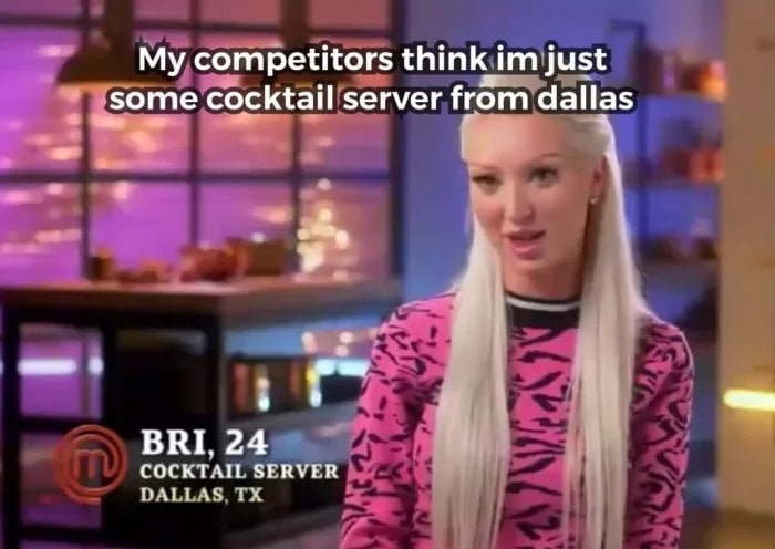 A screenshot from the reality TV series MasterChef featuring Bri, a 24-year-old cocktail server from Dallas, TX. Bri has long straight blonde hair and wears a bright pink top with black animal print. The background shows a kitchen/bar area with blurred purple and blue lighting, suggesting a competition setting. Overlaid text across the top reads: 'My competitors think im just some cocktail server from dallas,' implying Bri is underestimated. At the bottom left, identifying text reads 'BR I, 24 COCKTAIL SERVER DALLAS, TX' alongside a circular logo with a stylized 'M,' consistent with MasterChef's branding.