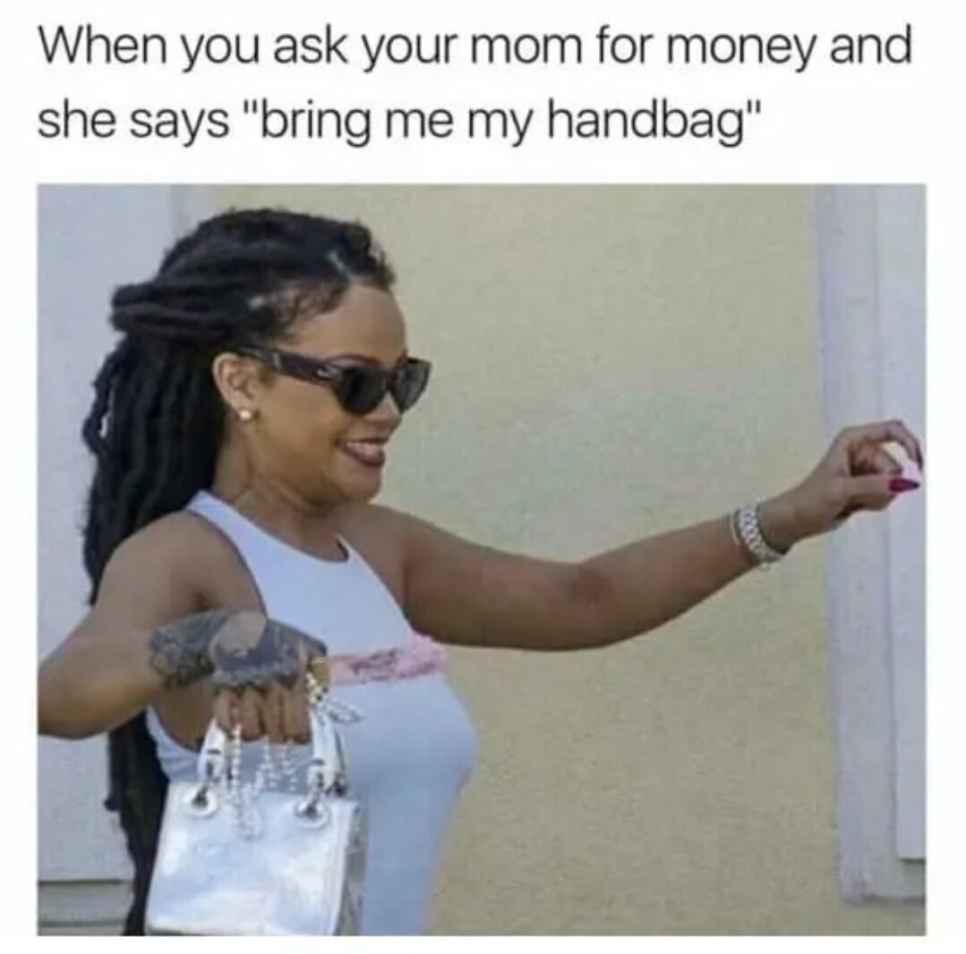 A meme featuring a photograph of a woman with dreadlocks, wearing sunglasses and a light blue sleeveless top. She is holding a small white handbag in one hand and extending the other hand as if offering or giving something, with a smiling expression. The top text reads: 'When you ask your mom for money and she says "bring me my handbag"', humorously depicting the relatable scenario where a parent asks for a small favor (fetching the handbag) before providing money, highlighting a wholesome and lighthearted parent-child interaction.