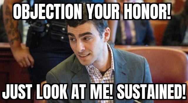 A meme featuring a man in a gray suit sitting in a courtroom setting. The image has bold white text at the top reading 'OBJECTION YOUR HONOR!' and at the bottom reading 'JUST LOOK AT ME! SUSTAINED!'. The man appears amused and confident, likely used as a reaction image to humorously reference legal objections in a sarcastic or exaggerated manner. The background shows other courtroom attendees, reinforcing the legal environment.