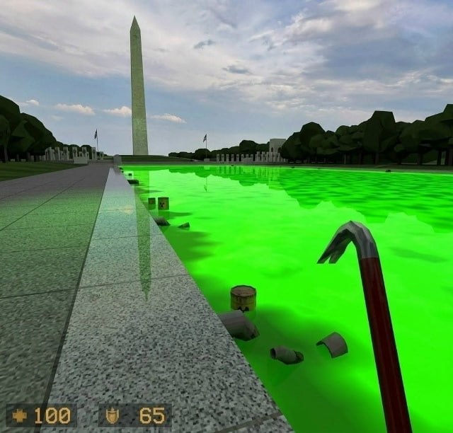 This is a first-person perspective crossover meme rendered in 3D. It reimagines the National Mall in Washington DC, with the Washington Monument visible at the far end of the site's famous reflecting pool, which has been modified to look like bright green toxic waste with floating radioactive barrels and debris. The iconic crowbar, signature starting weapon from the Half Life first-person shooter game series, is held in the foreground as if by the player, and the classic Half Life 1 heads-up display showing 100 health and 65 armor is placed at the bottom left of the frame, framing the scene as a custom playable level set in the US capital within the Half Life game universe.