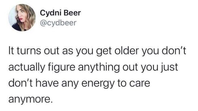This image is a screenshot of a public tweet from X (formerly Twitter) user Cydni Beer. The tweet features a relatable humorous observation about aging: it states that contrary to the common expectation that people learn to solve all of life's problems as they grow older, adults actually just run out of energy to care about most issues instead of figuring them out. The screenshot includes the user's profile headshot of a blonde woman, their display name, their @cydbeer handle, and the full text of the tweet on a plain white background.