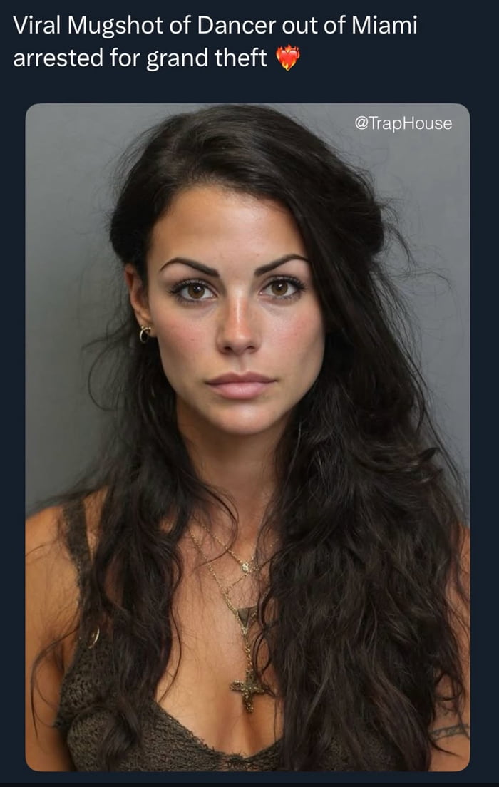 A mugshot photograph of a woman with long dark hair, wearing a dark top and a cross necklace. She has a neutral expression and is looking directly at the camera. The image has text at the top that reads 'Viral Mugshot of Dancer out of Miami arrested for grand theft 🔥' and a watermark '@TrapHouse' in the top right corner.