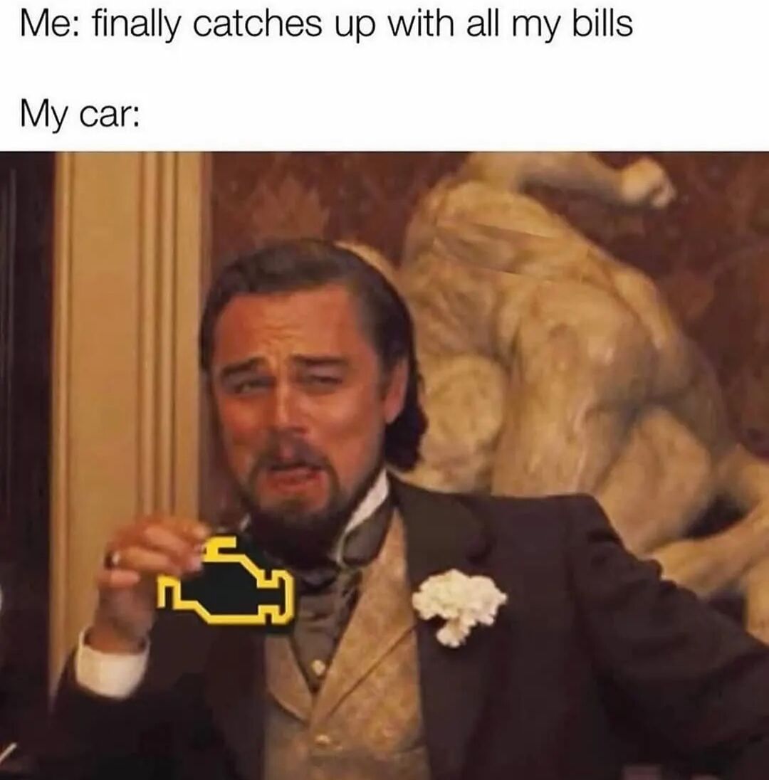 A meme with two text sections and an image. The top text reads 'Me: finally catches up with all my bills' followed by 'My car:'. Below is a screenshot of Leonardo DiCaprio from the film 'The Great Gatsby,' wearing a formal suit and standing in front of a classical statue. He holds a yellow car engine warning light icon with a concerned expression, humorously illustrating the scenario where a car breaks down immediately after the person catches up on bills, creating a relatable joke about unexpected expenses.