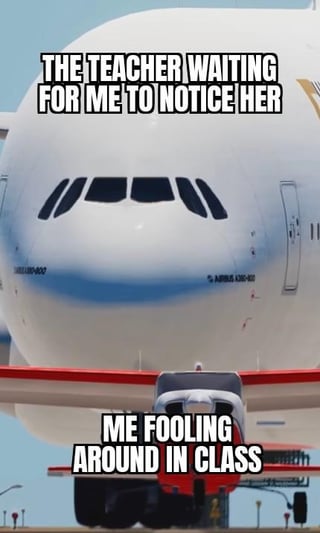 This is a relatable single-panel meme using a forced perspective photograph of two planes on an airport tarmac. A very large Airbus airplane looms directly over a much smaller plane, creating the illusion that the large plane is towering over the tiny, unaware smaller craft. Text over the large plane reads 'THE TEACHER WAITING FOR ME TO NOTICE HER', while text over the small plane reads 'ME FOOLING AROUND IN CLASS'. The joke plays on the relatable experience of being distracted and messing around during class, completely unaware that your teacher is staring right at you waiting for you to acknowledge them, making the teacher feel huge and imposing while you are oblivious.