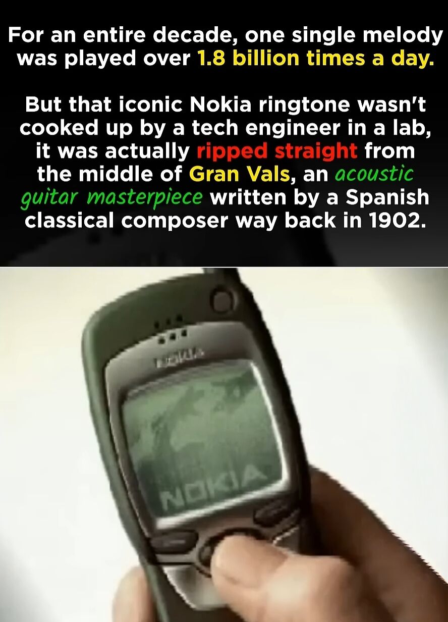 This meme is an informative, two-part image. The upper section displays text sharing a little-known fact: the globally recognizable Nokia ringtone, which was played over 1.8 billion times per day for an entire decade, was not developed by a technology engineer in a lab. Instead, it was adapted from *Gran Vals*, an acoustic guitar masterpiece composed by a Spanish classical musician in 1902. The lower section features a close-up photograph of a real person's hand holding a classic Nokia mobile phone, with a finger pressing one of its buttons, evoking nostalgia for early mobile technology. The meme combines education with nostalgia to create a wholesome, engaging piece of content.
