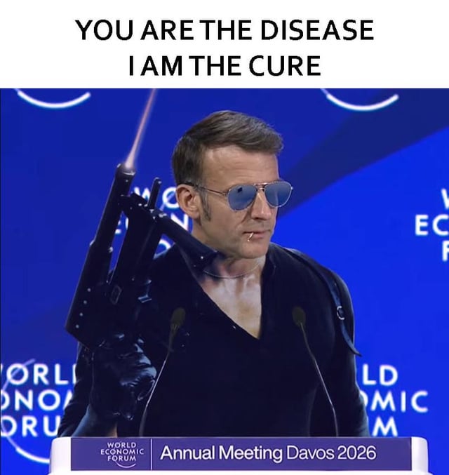 A meme featuring a person standing at a podium labeled 'World Economic Forum Annual Meeting Davos 2026'. The individual is dressed in a black outfit with a deep neckline, wearing reflective sunglasses, and has a rifle-like object slung over their left shoulder. Above the person, bold uppercase text reads 'YOU ARE THE DISEASE I AM THE CURE', creating a confrontational and satirical tone. The background displays the World Economic Forum logo, grounding the image in a real-world institutional context, while the added rifle and provocative text subvert the original event's serious nature.