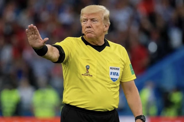 This is a satirical edited meme featuring former US president Donald Trump's head superimposed onto the body of an official 2018 FIFA World Cup referee. Trump wears a standard yellow FIFA referee jersey printed with 2018 Russia World Cup and official FIFA referee badges, has a stern scowling expression, and holds his right hand out in a clear stop or halt gesture. The joke attached to the image claims FIFA has appointed Trump as the referee for the USA vs Belgium World Cup match, playing on popular associations with Trump's hardline immigration and border control policies to humorously imply he will stop Belgian players from advancing past the US side of the pitch or scoring against the US team.
