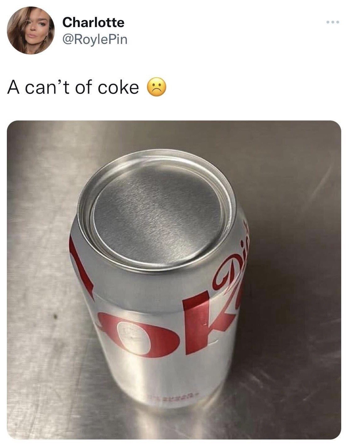 This is a screenshot of a public X (formerly Twitter) post. The post shows a defective Diet Coke soda can that has sealed flat metal ends on both its top and bottom, with no pull tab present to open the container, placed on a brushed metallic countertop. The poster's caption reads 'A can't of coke' paired with a sad frowning face emoji, which is a wordplay pun on the common phrase 'a can of coke' — the can cannot be opened, so it is jokingly referred to as a 'can't'.