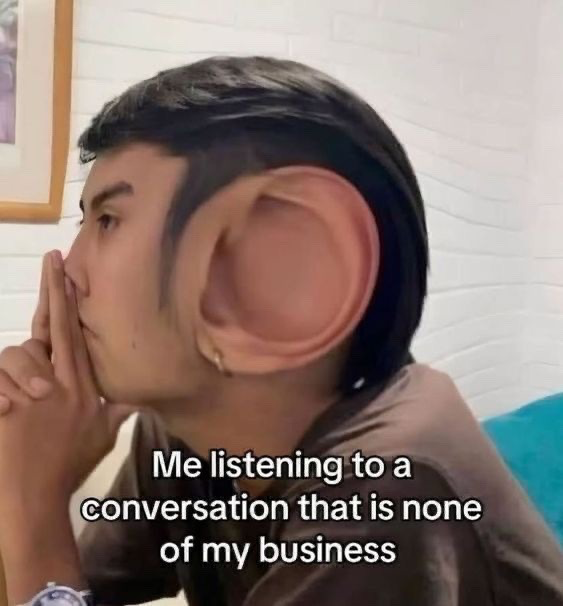 This is a humorous edited photo meme showing a young man in profile, holding his hands up close to his mouth as if concentrating intently. His ear has been digitally altered to be massively oversized, resembling an elephant ear, to visually exaggerate that he is listening extremely closely. The white text caption at the bottom of the image reads 'Me listening to a conversation that is none of my business', poking fun at the common relatable behavior of being nosy and intentionally eavesdropping on conversations that do not involve the listener.
