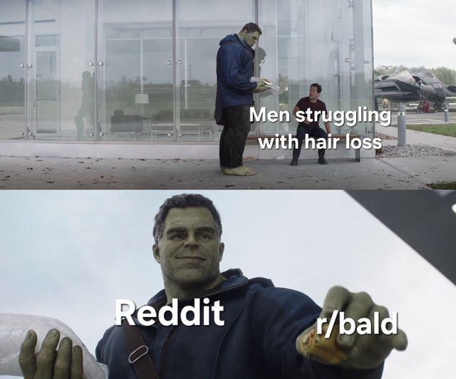 A two-panel meme featuring the Hulk from the Marvel Cinematic Universe. The top panel shows Hulk (large, green, bald) standing next to a smaller person outside a glass building, with the text 'Men struggling with hair loss'. The bottom panel is a close-up of Hulk smiling, holding a roll (possibly toilet paper), with the text 'Reddit' and '/r/bald' overlaid, implying that the subreddit r/bald supports men dealing with hair loss.