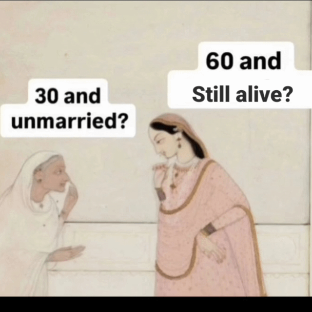 A meme using traditional South Asian miniature painting style depicting two women in conversation. The older woman on the left wears a white head covering and gestures with her hand while asking '30 and unmarried?' The younger woman on the right wears a pink sari with gold trim and responds '60 and Still alive?' creating a humorous reversal of societal expectations about marriage age.