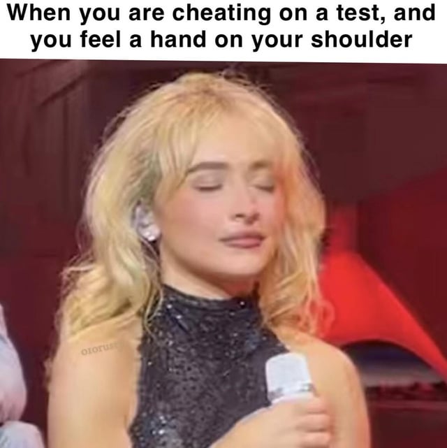 A meme consisting of a photograph of a blonde woman with wavy hair, wearing a black sequined halter top, holding a white microphone. The woman has her eyes closed and a serene, almost resigned expression. Above the image, there is a text overlay that reads: 'When you are cheating on a test, and you feel a hand on your shoulder'. The humor arises from the contrast between the woman's calm demeanor and the anxious scenario of potentially being caught cheating, making the meme relatable to experiences of academic stress or mischief.