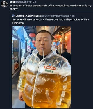 A meme featuring a real man wearing a puffy jacket designed to resemble a Tsingtao beer can, complete with a straw, creating a humorous visual joke of 'drinking' from the jacket. The image is accompanied by two Reddit comments: one from 'cel @celso_online_2h' dismissing state propaganda claims about the man being an 'enemy,' and another from 'unioncity_baby_social @unioncity_baby_social · 4h' satirically welcoming 'Chinese overlords' with hashtags #Beerjacket, #China, and #Tsingtao, blending humor with lighthearted cultural reference.