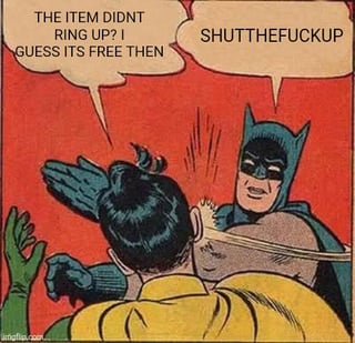 A comic-style meme panel with a red background featuring Batman in his classic costume aggressively grabbing another character (wearing a yellow outfit and green gloves) by the collar. The yellow outfit character has a speech bubble saying, 'THE ITEM DIDN'T RING UP! GUESS IT'S FREE THEN,' while Batman responds angrily with, 'SHUT THE FUCK UP.' The humor stems from Batman's overly intense reaction to a common joke about shoplifting by claiming an unringed item is 'free.'