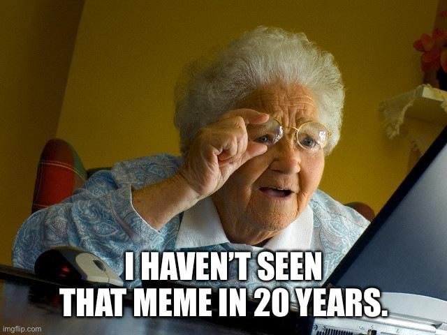 The image features an elderly woman with white hair, wearing round glasses and a blue patterned blouse, leaning forward towards a laptop. She adjusts her glasses with her right hand, displaying a surprised or amused expression. A bold text overlay at the bottom reads: 'I HAVEN’T SEEN THAT MEME IN 20 YEARS.' The bottom left corner contains the 'imgflip.com' watermark. The humor stems from the playful contrast of an elderly individual engaging with internet meme culture and the exaggerated nostalgia of a meme being '20 years old' (a lighthearted overstatement, as modern memes are younger than two decades).