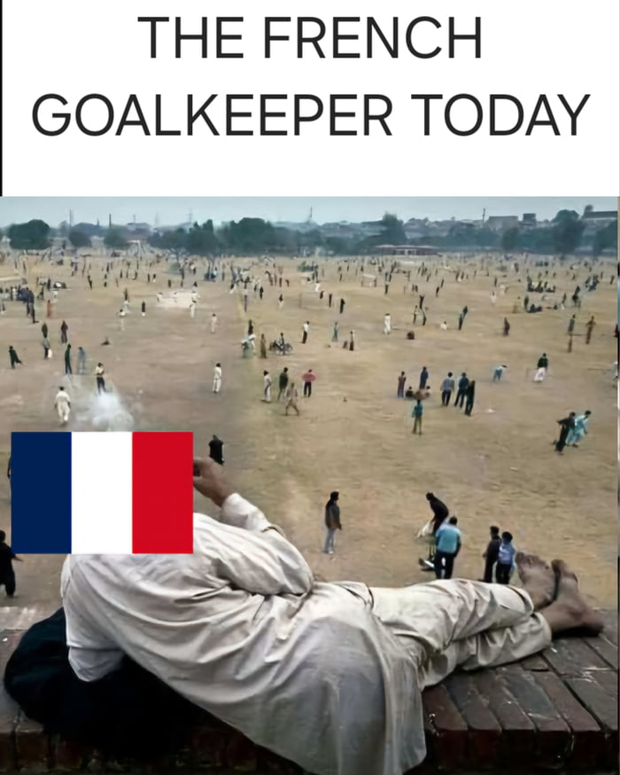 This is a humorous reaction meme referencing the 2022 FIFA World Cup semi-final match between France and Morocco. The top of the meme displays text that reads 'THE FRENCH GOALKEEPER TODAY'. Below the text is a photo of a vast, crowded open dirt field with hundreds of people scattered across it. In the foreground, a man in light-colored traditional clothing is lying casually on his side atop a brick ledge, with the French national flag placed over his face to represent the French goalkeeper. The joke implies that the French goalkeeper had almost no involvement in the match, as Morocco barely got any offensive opportunities near France's goal, so he could relax completely far away from the playing action without needing to perform any saves.