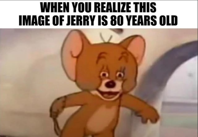 This is a single panel reaction meme. At the top, bold uppercase text reads 'WHEN YOU REALIZE THIS IMAGE OF JERRY IS 80 YEARS OLD'. Below the text is a classic frame of Jerry the mouse from the Tom and Jerry animated series, wearing a shocked, stunned expression with wide eyes and an open mouth, arms outstretched as if reeling from the unexpected, surprising realization about the age of the iconic cartoon character footage. The joke plays on viewers' nostalgia for the beloved cartoon, as many people associate Tom and Jerry with their childhood and are caught off guard by how many decades have passed since the series first debuted.