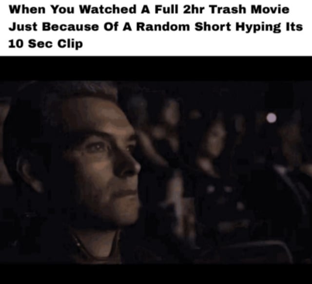 This is a reaction meme split into two sections: the top section has overlaid text describing the relatable experience of spending 2 hours watching a low-quality full movie just because you saw a hyped 10-second clip of it on a short-form video platform. The lower section is a still of the character Homelander from the live-action series *The Boys*, seated in a dark movie theater with a blank, regretful, deeply disappointed expression staring straight ahead, perfectly embodying the feeling of frustration and regret at having wasted time on a bad film.