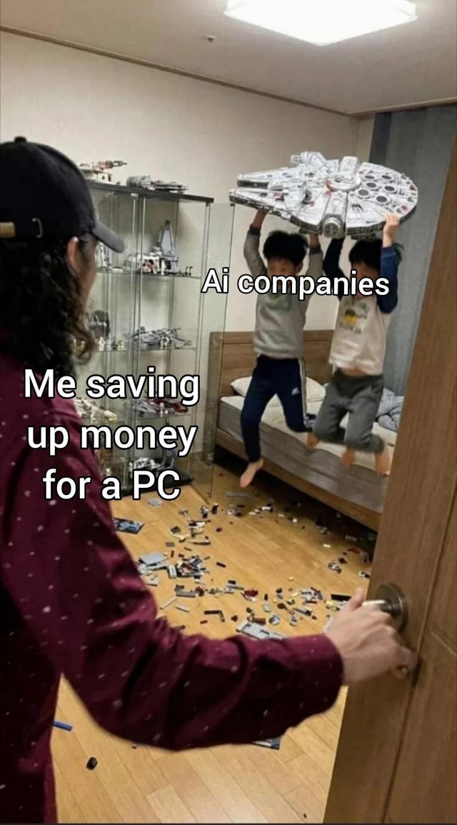 This is a relatable tech industry meme. An adult labeled 'Me saving up money for a PC' opens a bedroom door to find two children labeled 'Ai companies' jumping on a bed holding a large, expensive Lego Millennium Falcon set, with the entire floor covered in scattered, broken Lego pieces. The meme jokes about the rising cost of PC components, particularly GPUs, driven by extremely high demand from artificial intelligence companies purchasing hardware for model training, which makes saving up for a personal PC much harder and more expensive for regular consumers, as if their saved funds are being destroyed or wasted by AI industry demand.