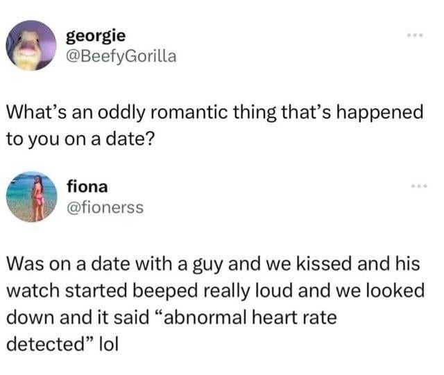 This image is a screenshot of a public X (formerly Twitter) thread. The first post, from user @BeefyGorilla (display name georgie), asks readers to share oddly romantic events that happened to them on a date. The reply, from user @fionerss (display name fiona), shares a personal anecdote: while on a date, she kissed her date, and his smart watch immediately beeped loudly to alert that an 'abnormal heart rate' was detected. The story is humorous and endearing, as the watch alert unintentionally reveals how much the kiss excited the date.