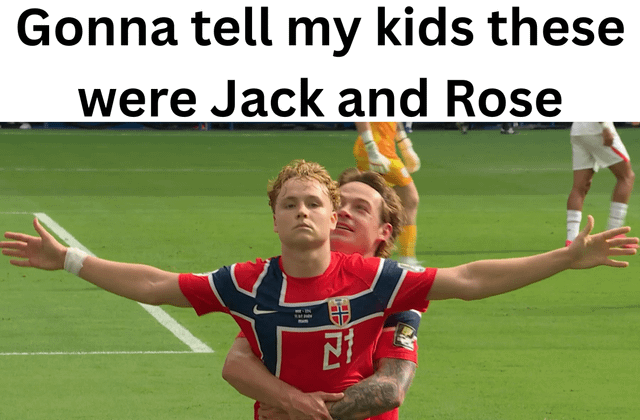 This meme features a photograph of two male Norwegian national team footballers celebrating on a green football pitch. The player in the front wears jersey number 21, holds his arms out wide to his sides with a neutral expression, while the player behind him wraps his arms around the front player's waist, smiling. The pair are posing identically to the iconic 'I'm flying' scene between Jack and Rose from the film *Titanic*. Text overlaid at the top of the image reads 'Gonna tell my kids these were Jack and Rose', making a silly, humorous joke that future children will be lied to about the identity of the pair in the photo, framing them as the famous *Titanic* characters.