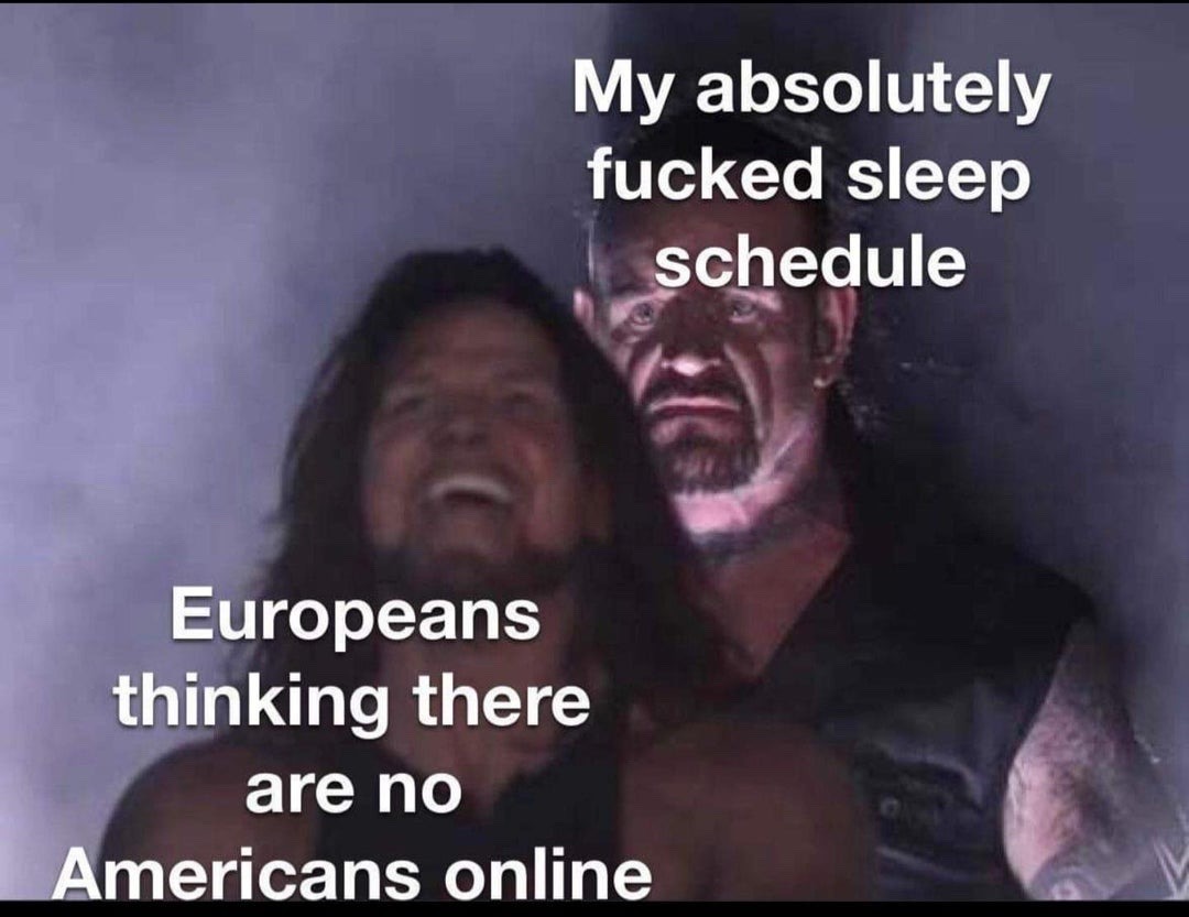 This meme uses a still frame from WWE content where professional wrestler AJ Styles is laughing obliviously in the foreground, while The Undertaker stands directly behind him with a menacing, stern expression. Overlaid text labels AJ Styles as 'Europeans thinking there are no Americans online', and labels The Undertaker as 'My absolutely fucked sleep schedule'. The joke humorously highlights that many Americans have highly irregular, unhealthy sleep cycles, meaning they are still active on the internet during hours that would be very late/early for European users, contradicting Europeans' assumption that no Americans would be online at those times, playing on the large time difference between the two regions.