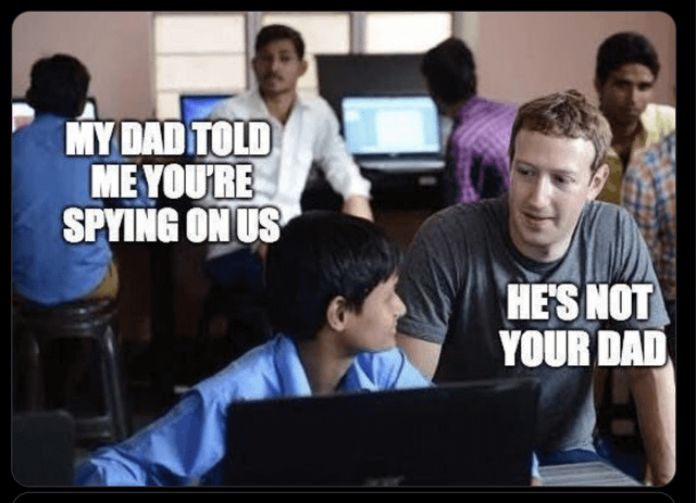 A meme depicting a scene in a computer lab with several people working at computers in the background. In the foreground, a young boy in a blue shirt sits at a computer desk, looking up at a man resembling Mark Zuckerberg. The boy's text reads 'MY DAD TOLD ME YOU'RE SPYING ON US,' and the man responds with 'HE'S NOT YOUR DAD.' The meme satirizes concerns about Meta's data privacy practices by implying the man dismisses the boy's claim by denying the boy's father's authority.