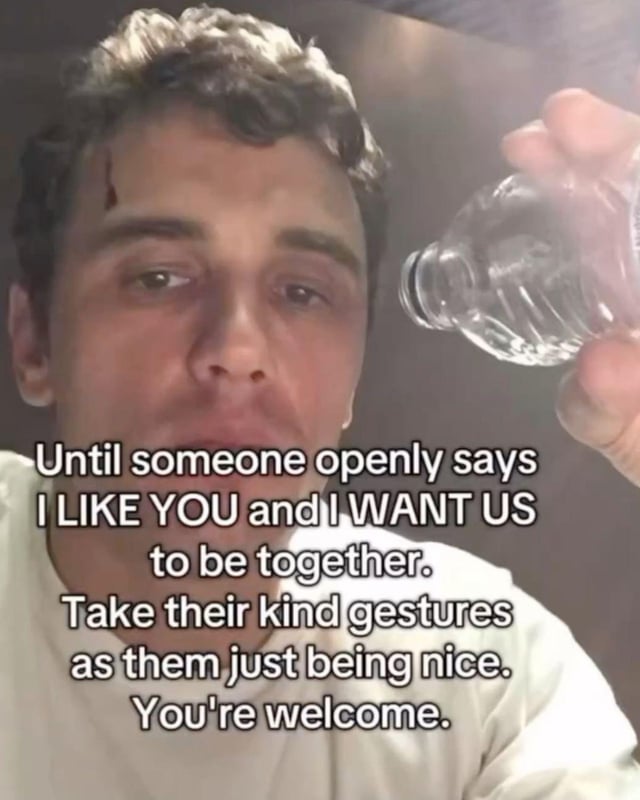 A meme featuring a real person holding a clear water bottle, with a prominent text overlay. The text advises: 'Until someone openly says I LIKE YOU and I WANT US to be together. Take their kind gestures as them just being nice. You're welcome.' The individual has a neutral to slightly tired expression, wearing a white shirt, and the background is indistinct. The tone is relatable and subtly sarcastic, humorously addressing the common experience of misinterpreting friendly gestures as romantic interest.