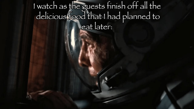 This is a relatable reaction meme using a still from the 2023 film *Oppenheimer*. The image shows a close-up of the title character, played by Cillian Murphy, wearing a protective radiation helmet, looking somber, defeated, and resigned as he stares off to the side. White overlaid text at the top of the image reads: 'I watch as the guests finish off all the delicious food that I had planned to eat later:'. The meme humorously highlights the common, petty but deeply disappointing feeling of having guests eat all the food you had reserved and been looking forward to eating later, matching the character's somber expression perfectly to this everyday frustration.