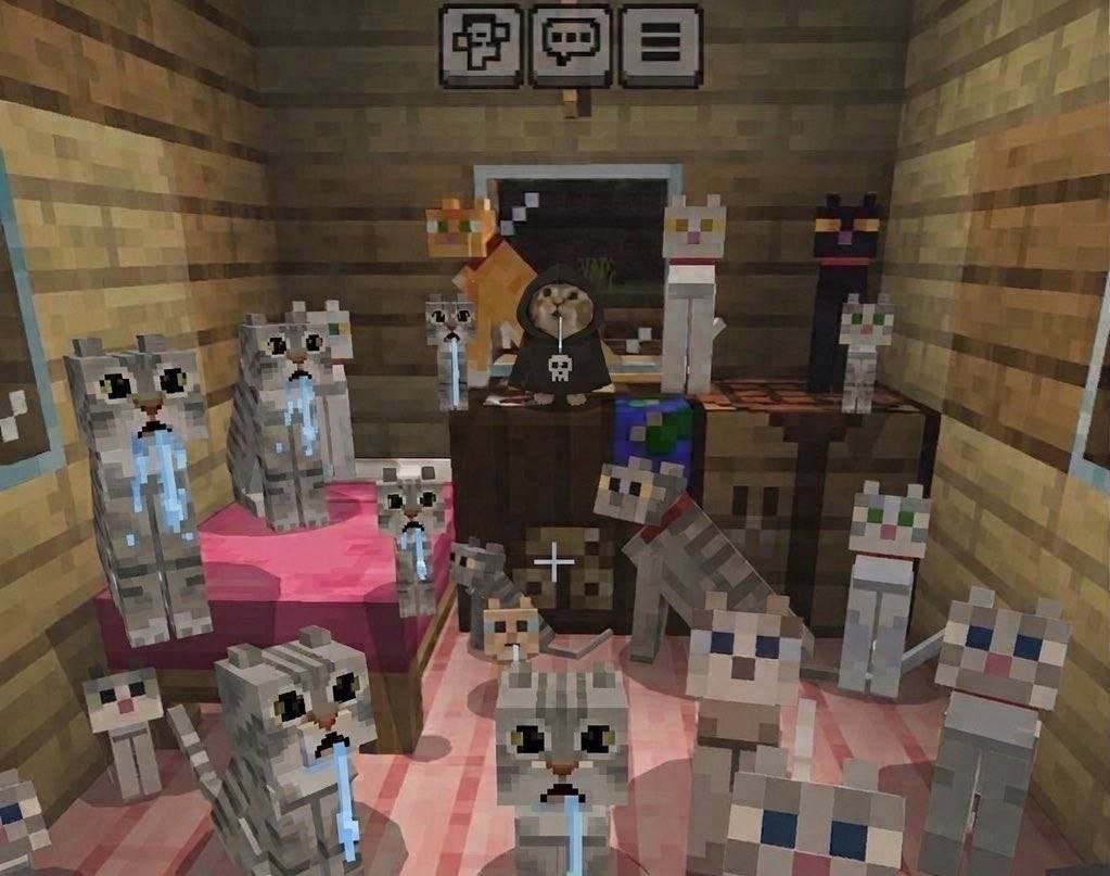 The image shows a humorously edited Minecraft interior scene framed as a cat funeral service. The room has wooden plank walls, a pink bed, crafting tables, and standard Minecraft UI menu icons at the top of the frame. At the front of the room on a raised podium, a real cat photo is composited into the scene: the cat wears a black grim reaper hoodie printed with a white skull, sipping from a clear straw. The rest of the room is filled with multiple vanilla Minecraft cat mobs, all edited to have blue dripping tear/snot streaks coming from their faces, positioned as if they are mournfully attending the service.
