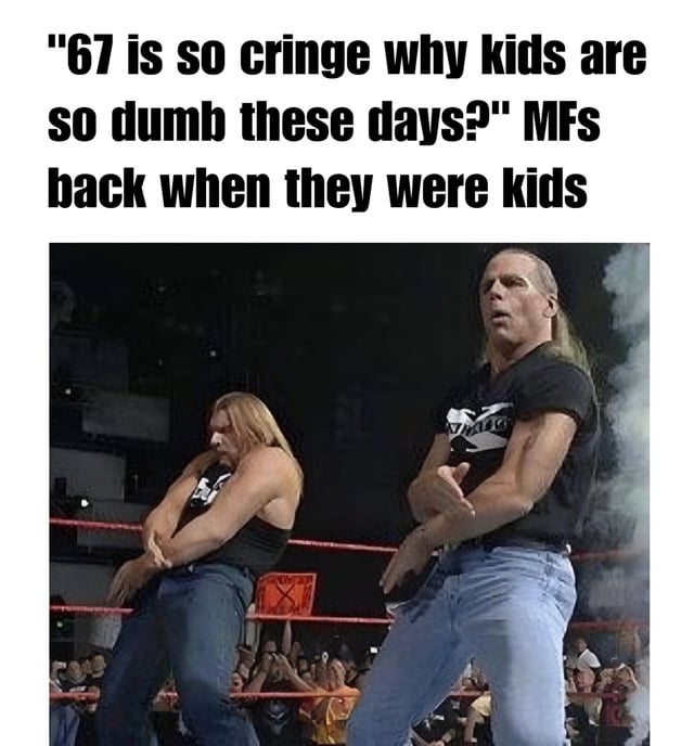 The meme features a top caption that reads: "67 is so cringe why kids are so dumb these days?" MFs back when they were kids, followed by an image of two muscular men in a professional wrestling ring. The men are wearing black shirts with white designs and blue jeans, posing with intense expressions—one has arms crossed while the other stands with hands clasped. The background shows a wrestling ring with ropes, an audience, and smoke, emphasizing a classic wrestling event setting. The humor stems from satirizing generational criticism: adults mocking younger generations' "cringe" behavior while the image reveals their own past participation in similarly over-the-top, cringe-worthy activities (represented by the exaggerated wrestling poses).