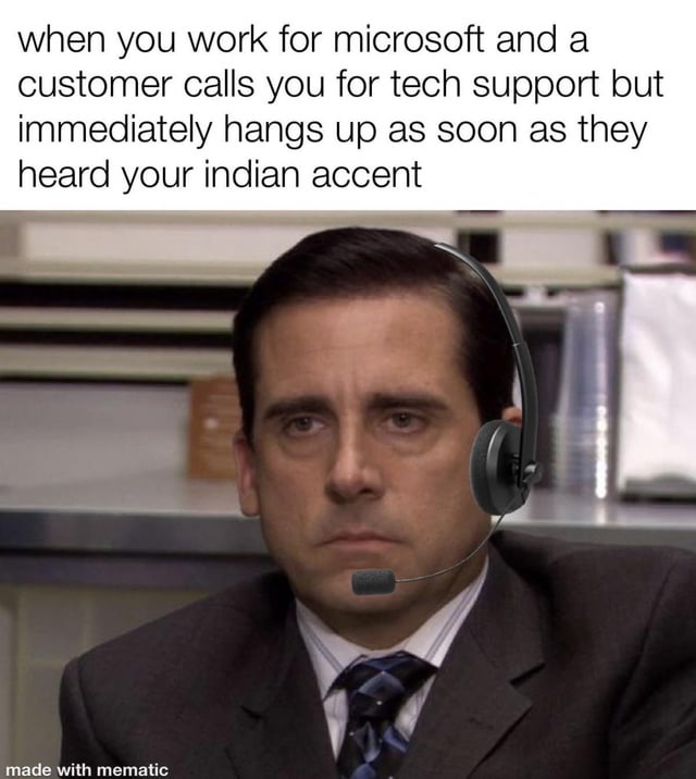 The meme features a top text caption and a screenshot from the US TV series 'The Office'. The caption reads: 'when you work for microsoft and a customer calls you for tech support but immediately hangs up as soon as they heard your indian accent'. Below the text is a screenshot of Michael Scott (played by Steve Carell) wearing a headset, seated in an office environment with a neutral, slightly resigned expression. The image is watermarked with 'made with mematic' at the bottom. It satirizes the stereotype of customers hanging up on tech support agents with Indian accents, using Michael Scott's character to convey relatable workplace frustration.