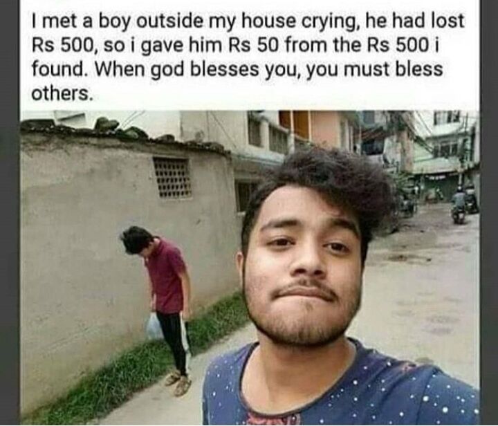 This is a wholesome meme consisting of a real-life street photograph with a story text at the top. The text tells that the man taking the selfie found 500 rupees, then encountered a boy crying outside his house who had lost 500 rupees, so he gave the boy 50 rupees from the money he had just found, ending with the moral that when God blesses you, you must bless others. In the photo, the man taking the selfie is in the foreground, and the sad boy is standing against a concrete wall on the side of the residential street looking down.