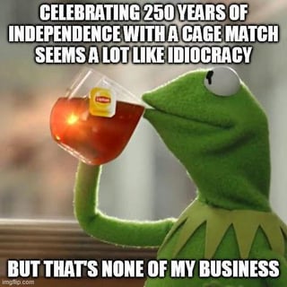 This is a meme using the popular Kermit the Frog sipping tea template. The top text reads "CELEBRATING 250 YEARS OF INDEPENDENCE WITH A CAGE MATCH SEEMS A LOT LIKE IDIOCRACY". Kermit, a green Muppet character, is shown holding a clear plastic cup of iced tea and sipping it with a nonchalant, judgmental expression. The bottom text reads "BUT THAT'S NONE OF MY BUSINESS". The meme humorously criticizes the idea of holding a cage match to celebrate the 250th United States independence anniversary, comparing the concept to the absurd, dumbed-down society depicted in the satirical film *Idiocracy*, while leaning into the sarcastic, pretend-uninterested tone of the classic Kermit meme format.