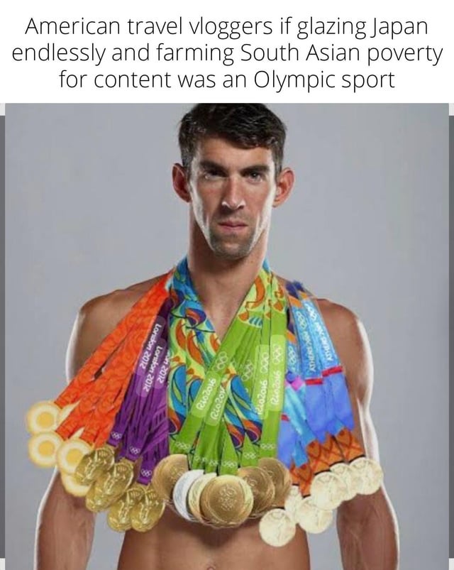 A satirical meme combining a photograph of Olympic swimmer Michael Phelps with overlay text. The image shows Phelps shirtless, wearing numerous gold Olympic medals around his neck, a reference to his record-breaking medal count. The top text reads: 'American travel vloggers if glazing Japan endlessly and farming South Asian poverty for content was an Olympic sport'. This meme critiques the perceived behavior of some American travel vloggers who excessively praise Japan ('glazing') and exploit South Asian poverty for content, humorously suggesting they would dominate this hypothetical Olympic sport with numerous medals.