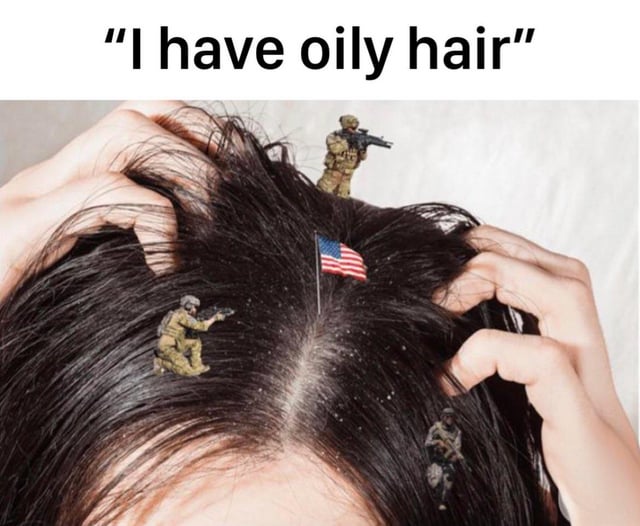 The meme features a close-up image of a person's dark hair being held by their hands. On the hair, there are small toy military soldiers (equipped with rifles) and a tiny American flag. The top text reads "I have oily hair". The humor stems from a satirical analogy: comparing the "oil" in oily hair (sebum) to valuable oil resources, with the toy soldiers and American flag implying military intervention/protection of such resources, referencing real-world geopolitical themes of oil resource conflicts.