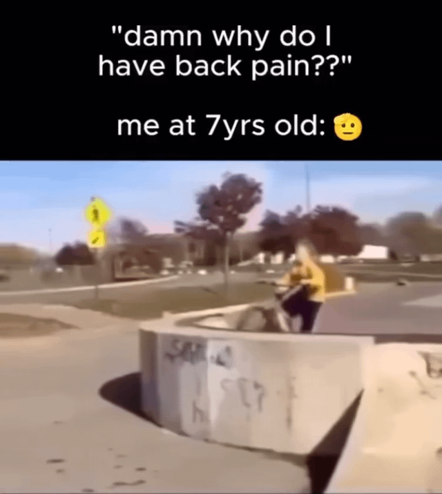 This meme jokes about the common experience of adults being confused about unexplained back pain by showing the often-forgotten cause: the reckless, dangerous stunts people performed as children. The top section of the meme has text first reading 'damn why do I have back pain???' followed by 'me at 7yrs old:' and a raised-eyebrow neutral emoji. The bottom half of the image shows a young child riding a scooter directly off a raised concrete curb structure in a public park, performing a dangerous stunt that would likely cause long-term bodily harm over time.