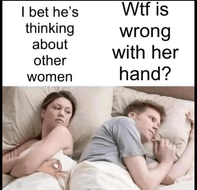 An image of a man and woman lying in bed, facing away from each other, with two text captions above them. The left caption reads 'I bet he's thinking about other women' and the right caption reads 'Wtf is wrong with her hand?'. The humor arises from the contrast between the woman's assumption about the man's thoughts and the man's actual concern about her hand.