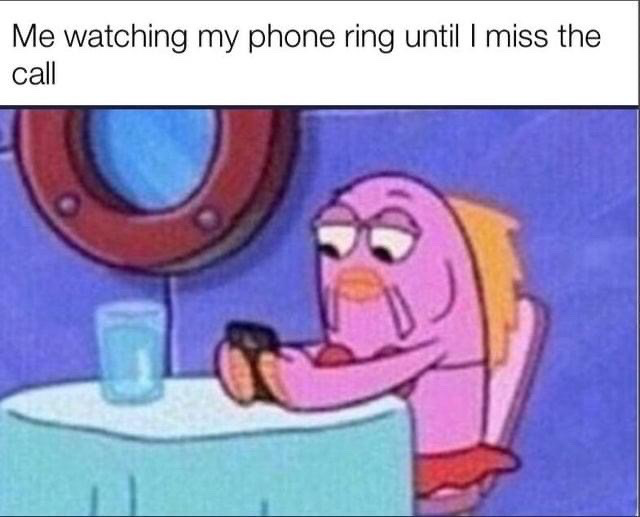 This meme features a screenshot of a purple background fish character from the animated series SpongeBob SquarePants. The character is sitting at a restaurant-style table, holding a phone with a bored, unmotivated blank expression while staring at the device. A text overlay at the top of the image reads "Me watching my phone ring until I miss the call", humorously depicting the common relatable experience of intentionally avoiding answering incoming phone calls due to social anxiety, general dislike of phone calls, or lack of motivation to talk, by waiting passively until the call stops ringing.