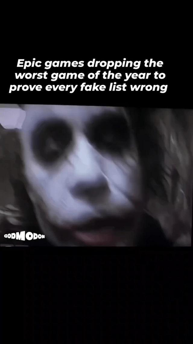 A meme featuring white text at the top reading 'Epic games dropping the worst game of the year to prove every fake list wrong' overlaid on a blurry, dynamic screenshot of a character with white face paint, green hair, and a menacing grin, resembling the Joker from *The Dark Knight* (2008). A watermark 'GODMODON' is visible in the bottom left corner. The image combines gaming humor with a pop culture reference to create a sarcastic commentary on game award lists.