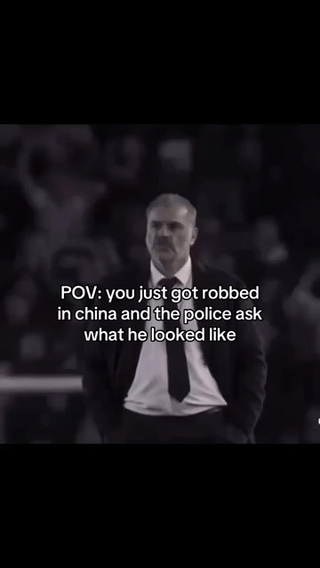 This is a point-of-view (POV) joke meme that uses a heavily blurred photograph of soccer manager Ange Postecoglou. The overlaid text sets the scenario: you just got robbed in China, and police ask you to describe what the robber looked like. The humor comes from the extreme blurriness of the image, which visually represents that you cannot clearly identify or describe the robber's face, making the blurry photo the perfect stand-in for your description.