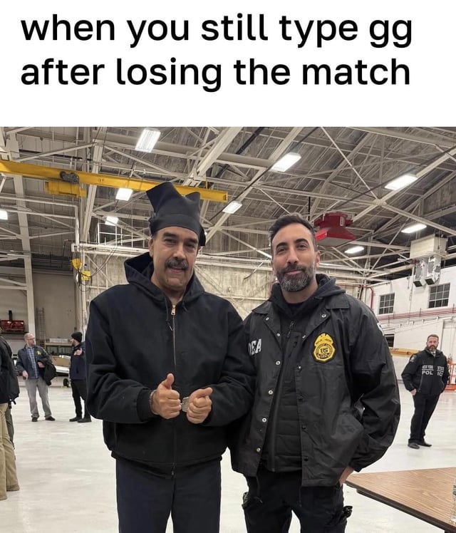 A meme featuring a real photograph of two men standing in an industrial or warehouse setting. The top text reads 'when you still type gg after losing the match', humorously depicting the act of maintaining sportsmanship by typing 'gg' (good game) despite losing, with the left man giving a thumbs-up to emphasize forced or genuine good sport behavior.