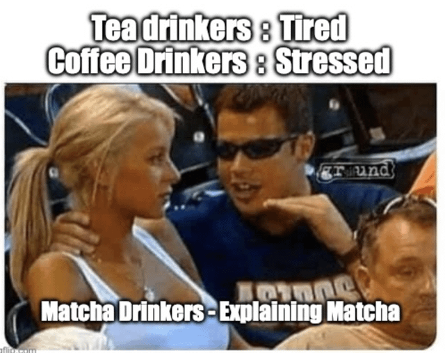 A meme humorously comparing stereotypes of tea, coffee, and matcha drinkers through text overlays on a real photograph. The top text labels 'Tea drinkers : Tired' and 'Coffee Drinkers : Stressed', while the bottom text reads 'Matcha Drinkers - Explaining Matcha'. The image features two main individuals: a man animatedly gesturing with his hand (presumably embodying the 'explaining matcha' stereotype) and a woman leaning in attentively, with another person visible in the background. The casual setting suggests a public event or gathering, enhancing the relatable, everyday humor of the beverage-based stereotypes.