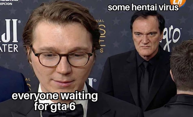 This meme uses a viral red carpet event photograph of Paul Dano and Quentin Tarantino as its base. Paul Dano appears in the foreground with a faint, distracted smile while looking down, overlaid with the text label 'everyone waiting for gta 6'. Quentin Tarantino stands directly behind Dano, staring forward with an intense, menacing unblinking expression, overlaid with the text label 'some hentai virus'. The joke illustrates that people eagerly anticipating the release of the highly popular Grand Theft Auto 6 video game are so distracted by their excitement that they are vulnerable to malware attacks disguised as GTA 6 leaks, early access downloads, or exclusive content, particularly pornographic (hentai) themed malware that commonly targets users searching for unannounced game content.