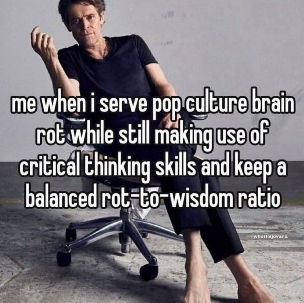 This is a reaction meme featuring actor Willem Dafoe slouching casually and barefoot in a rolling office chair, making a smug, self-satisfied hand gesture. Large overlaid text on the image reads: 'me when i serve pop culture brain rot while still making use of critical thinking skills and keep a balanced rot-to-wisdom ratio'. The meme humorously references the relatable experience of enjoying low-effort, mindless pop culture media while still retaining critical thinking abilities and maintaining a healthy balance between leisure consumption and intellectual engagement.