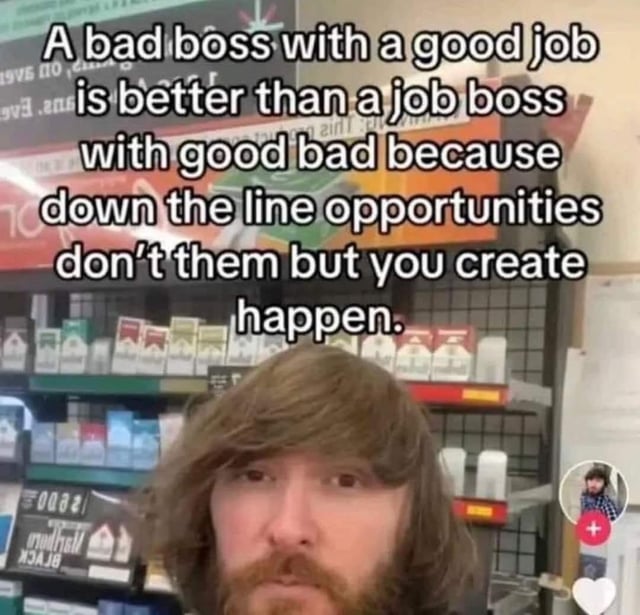 The image is a meme featuring a person standing in a store with shelves of products (likely beverages or household items) in the background. The individual has long, light brown hair and a beard, looking directly at the camera with a neutral expression. Overlaid text at the top contains a grammatically jumbled statement: 'A bad boss with a good job is better than a job boss with good bad because down the line opportunities don’t them but you create happen.' In the bottom right corner, there is a small circular inset showing another person (possibly the uploader) and a white heart icon, suggesting a social media interface.