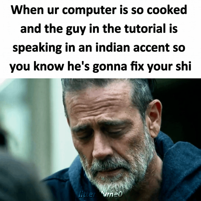 This meme pairs a popular reaction screenshot of the character Negan from *The Walking Dead* looking tearfully relieved with top text about broken computers and tech tutorials. The joke plays on the widespread internet stereotype that Indian tech tutorial creators are extremely skilled at fixing even the most severely broken ('cooked') computer issues, so finding a tutorial hosted by someone with an Indian accent guarantees the user will be able to fix their device. The character's relieved, emotional expression perfectly matches the feeling of relief when a user finds a working solution for their broken tech.