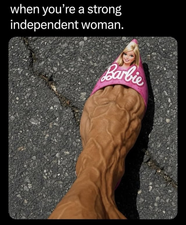 The meme features white text on a black background at the top reading 'when you’re a strong independent woman.'. Below the text is a first-person photograph of a person's extremely vascular, heavily muscular lower leg and foot, standing on dark cracked asphalt. The foot is wearing a small, pointed pink slipper emblazoned with the white 'Barbie' logo and a print of the classic blonde Barbie character's smiling face. The core joke is the humorous, absurdist contrast between the hyper-feminine, traditionally dainty Barbie branding and the very muscular, physically strong leg wearing the slipper, which literalizes the common phrase 'strong independent woman' in a visual pun.