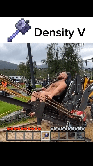 A meme combining a real-life photograph with Minecraft game elements. The image features a shirtless man sitting on a mechanical amusement ride (likely a bungee swing or tension-based ride), displaying an intense, straining expression. At the top, there is a Minecraft-style enchantment label reading 'Density V' accompanied by an anvil icon, referencing Minecraft's enchantment system. The bottom of the image includes Minecraft UI elements: a health bar (red hearts), a hunger bar (chicken legs), and a hotbar with an anvil item. The humor lies in personifying the fictional 'Density V' enchantment (which would logically increase density/weight) in real life, implying the man's intense experience is due to this enchantment making him extremely heavy.